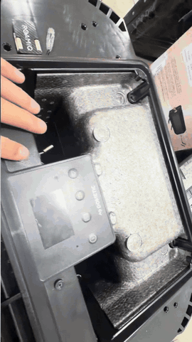 Lifting the RTX unit and wiggling it free of the sealant